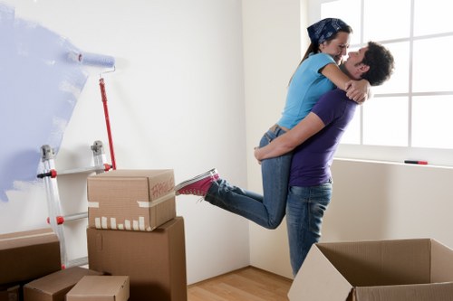 Mover using safe techniques while carrying items through a property