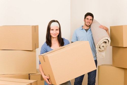 Team member handling packed boxes with care during a Richmond move
