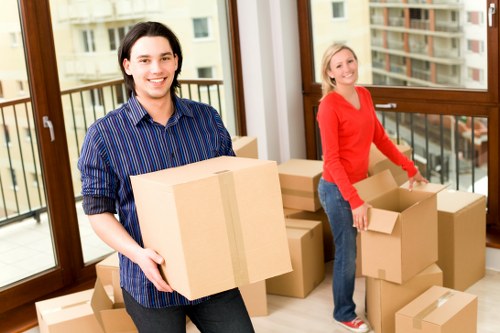 Professional house moving team unloading furniture at a Richmond home